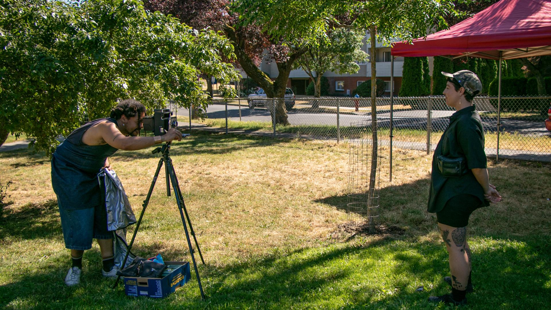 Person in front of camera for art project